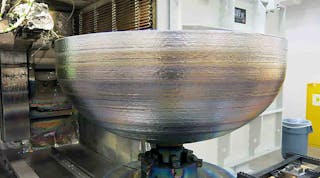 The titanium dome for a satellite fuel tank, produced via additive manufacturing.