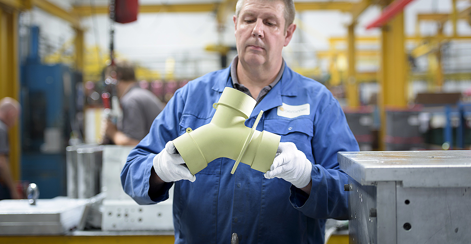 Aeromet Intl worker w/prototype