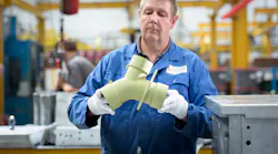 Aeromet Intl worker w/prototype