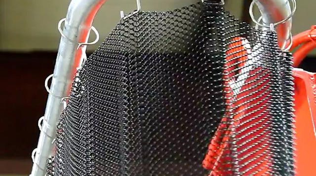 The Ejection Curtain Guarding Kit shields hydraulic press operators with a coiled wire fabric guard, reducing the risk of cuts and lacerations from flying debris.