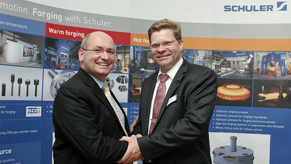 Schuler SMG managing director Arnd Kulaczewski right and Simufact Engineering CTO Dr Hendrik Schafstall confirm their companies new technology partnership