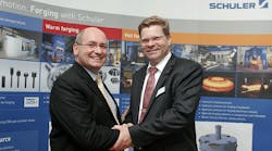 Schuler SMG managing director Arnd Kulaczewski (right) and Simufact Engineering CTO Dr. Hendrik Schafstall confirm their companies&rsquo; new technology partnership.