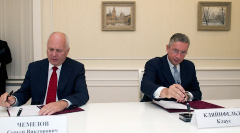 Alcoa chairman/CEO Klaus Kleinfeld (right) and VSMPO chairman Sergei Chemezov (left), signed an agreement to establish a new venture that will forge titanium and aluminum components for aircraft manufacturers worldwide.