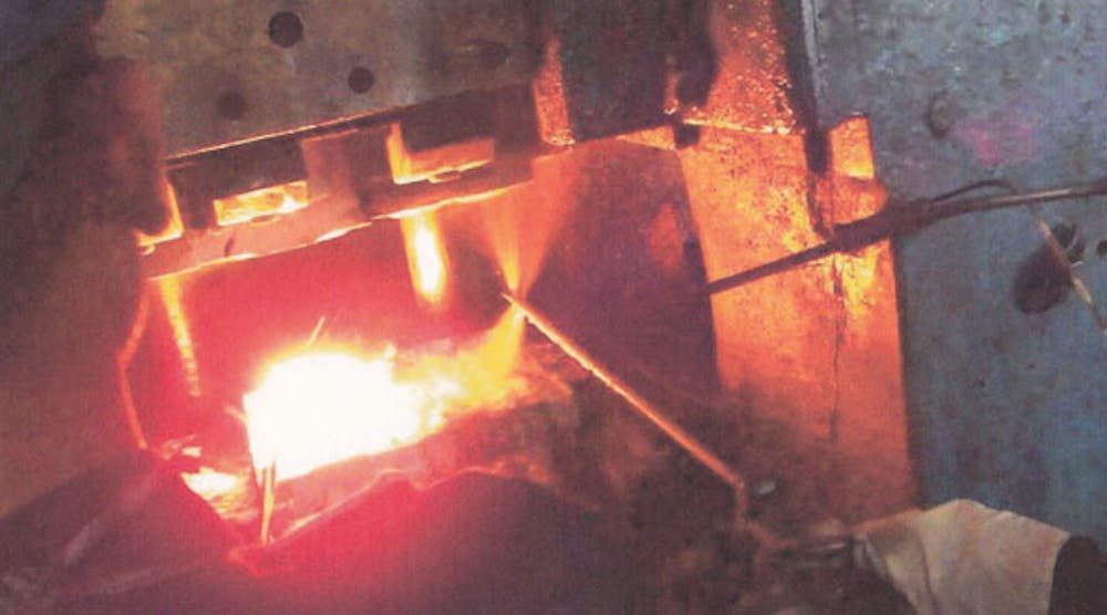 Typically, forging lubricants typically are sprayed into the die automatically or manually, or applied by swapping into the hot dies. This photo shows lubricant being sprayed manually with a double-action spray gun. Many forging operations will use automatic sprays that are timed with the stroke of the forging press. Deeper cavity dies may require the use of a supplemental spray to ensure thorough coverage of the die surface and cavity.
