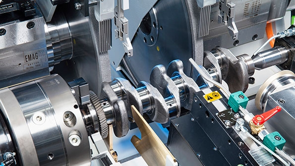Two grinding wheels are used for simultaneous machining of two pin bearings reducing cycle time considerably