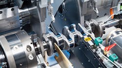 Two grinding wheels are used for simultaneous machining of two pin bearings, reducing cycle time considerably.