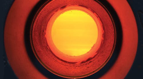 A view inside a seven-tube test fixture, while testing seals for pressurized tubes. The tubes can be seen glowing a 1,800&deg;F.