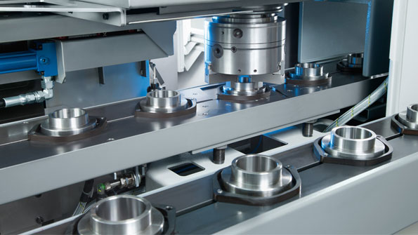 Highvolume highcomplexity finishing is supported by integrated automation systems as shown on this EMAG vertical turning system