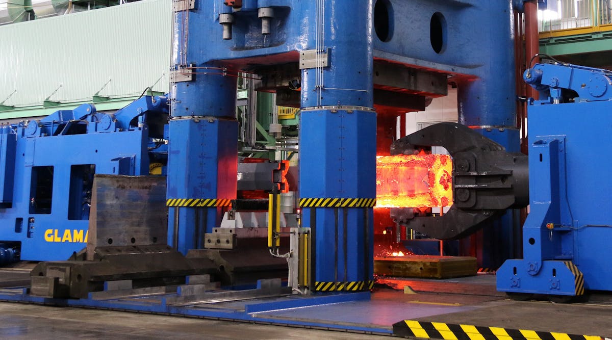 The 90/108-MN open-die forging press in operation at the Hitachi Metals Yasugi Works.
