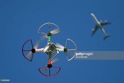 Www Newequipment Com Sites Newequipment com Files Drone Flying Under Plane Getty Images 487540678