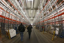 EHINGEN, GERMANY - NOVEMBER 28: Bidders inspect articles displayed in a warehouse for the final auction at Schlecker headquarters on November 28, 2012, in Ehingen, Germany. Schlecker, which operated thousands of stores nationwide, went into bankruptcy earlier this year and over 10,000 employees lost their jobs. EHINGEN, GERMANY - NOVEMBER 28: Bidders inspect articles displayed in a warehouse for the final auction at Schlecker headquarters on November 28, 2012, in Ehingen, Germany. Schlecker, which operated thousands of stores nationwide, went into bankruptcy earlier this year and over 10,000 employees lost their jobs.