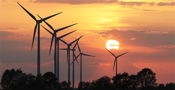 Wind turbines at sunset