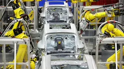 Robotic arms in automotive factory