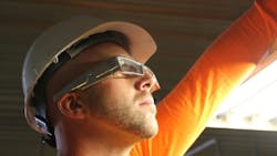 Worker in hardhat wearing xoeye smart glasses Worker in hardhat wearing xoeye smart glasses