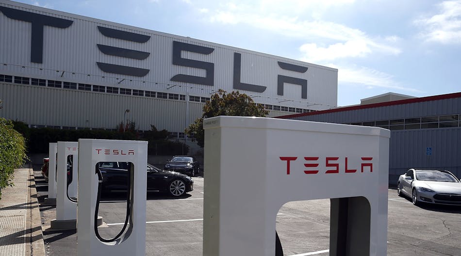 A row of new Tesla Superchargers are seen outside of the Tesla Factory on August 16, 2013 in Fremont, California.