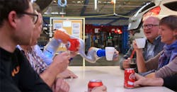 kuka-ford-factory-hand-coke kuka-ford-factory-hand-coke