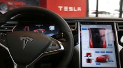 The inside of a Tesla vehicle is viewed as it sits parked in a new Tesla showroom and service center in Red Hook, Brooklyn on July 5, 2016 in New York City.