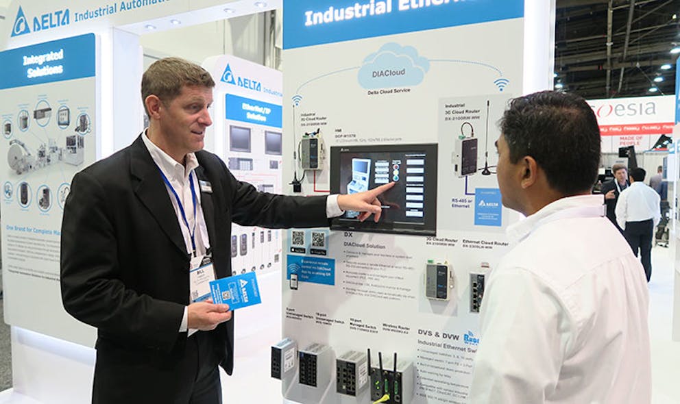 Bill Faber, Delta&apos;s Industrial Automation Team Leader, shows a PACK EXPO 2017 visitor the company&apos;s latest in automated equipment solutions.