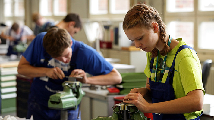 Young engineering students ply their craft and trade.