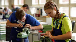 Young engineering students ply their craft and trade.