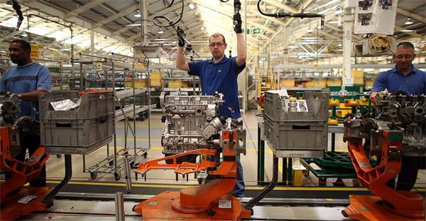 Assembly line worker building motor