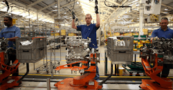 Assembly line worker building motor Assembly line worker building motor