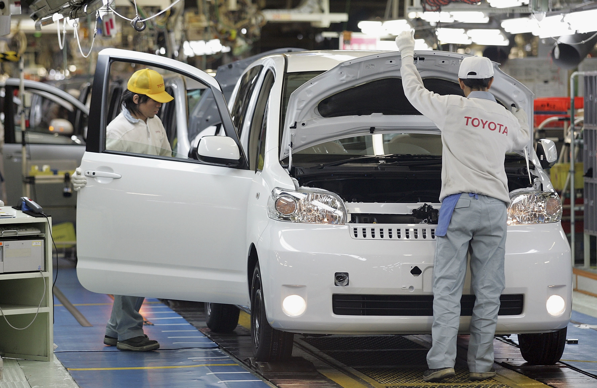 Toyota factory workers on assembly line