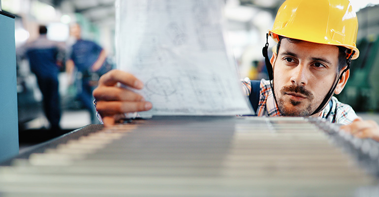 young manufacturing guy wearing hardhat