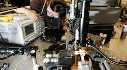 Woman-Testing-Electronics Woman-Testing-Electronics