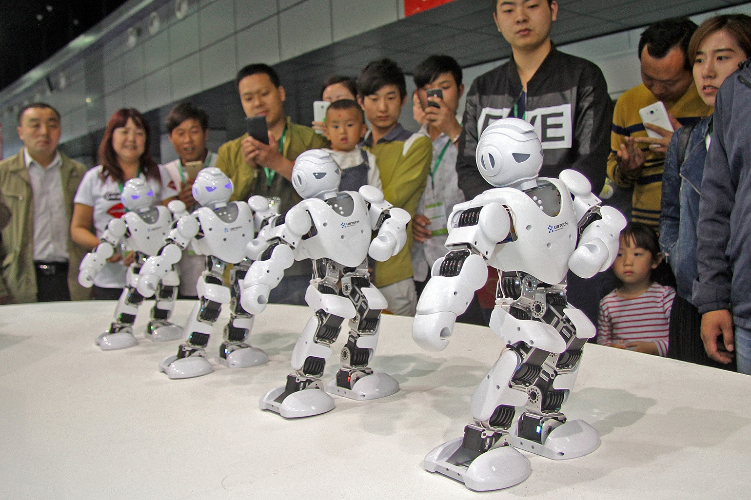 Four-White-Robots-In-Same-Stance