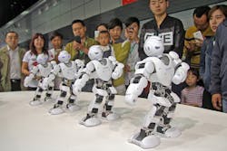 Four-White-Robots-In-Same-Stance Four-White-Robots-In-Same-Stance