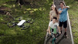A promotional photo of a family taking a selfie with the DJI Spark drone A promotional photo of a family taking a selfie with the DJI Spark drone