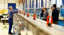 plant operations worker hooking up two parts plant operations worker hooking up two parts