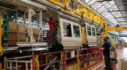 Newequipment 73 Plant Operations Workers Assembling Train