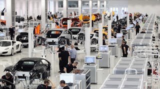 Workers assemble high performance McLaren MP4-12C sports cars