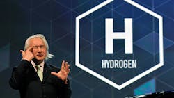 Man speaking on stage Man speaking on stage