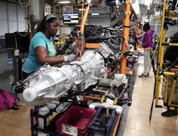 Worker-Assembling-Car-Parts Worker-Assembling-Car-Parts