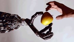 Robotic hand passing apple to human Robotic hand passing apple to human