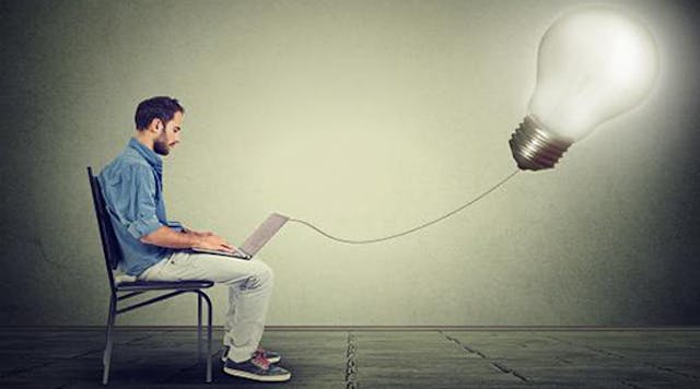 Man with laptop connected to lightbulb