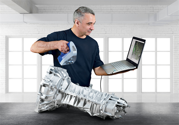 Man using Artec Spider to scan gearbox