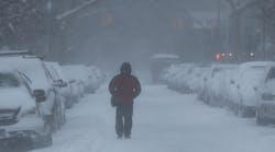 Man Walking Snowy Street