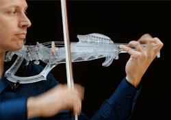 Man playing 3D printed violin Man playing 3D printed violin
