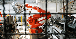 Robotic arm in factory Robotic arm in factory