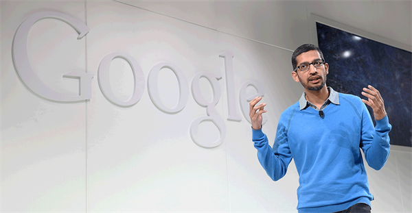 Man speaking in front of Google logo