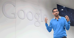 Man speaking in front of Google logo Man speaking in front of Google logo