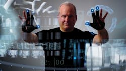 Man using see through touchscreen Man using see through touchscreen