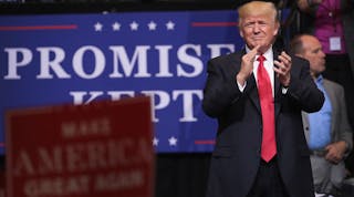 President Donald Trump arrives for a rally on June 21, 2017 in Cedar Rapids, Iowa. Trump spoke about renegotiating NAFTA and building a border wall that would produce solar power during the rally.