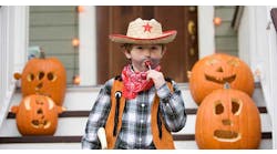 Cowboy kid with lollipop on Halloween