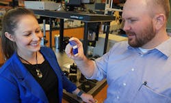 Travis Walker, Ph.D., holds an example of a 3D printed item made with two different materials. He and Katrina Donovan, Ph.D., say this object is a large-scale example of the kind of 3D printed materials now possible at scales smaller than a human hair. Travis Walker, Ph.D., holds an example of a 3D printed item made with two different materials. He and Katrina Donovan, Ph.D., say this object is a large-scale example of the kind of 3D printed materials now possible at scales smaller than a human hair.