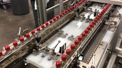 50ml bottles of spirits lined up for infeed to the Orbital Vertical System for shrink wrapping. 50ml bottles of spirits lined up for infeed to the Orbital Vertical System for shrink wrapping.